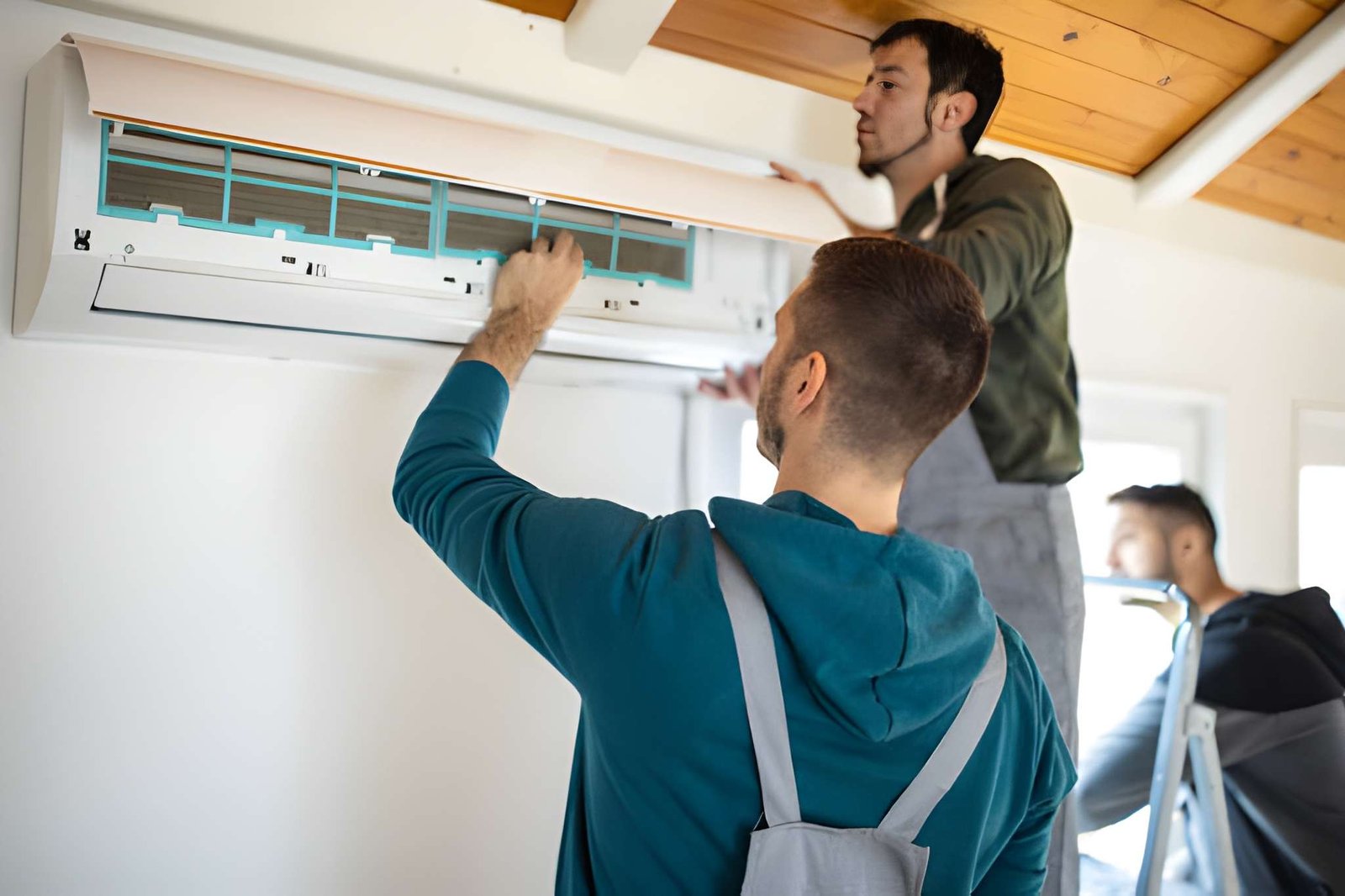 HVAC technician repairing AC unit to improve cooling and indoor air quality